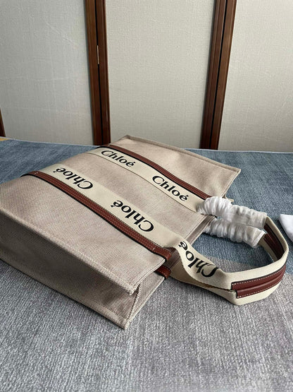 LAGRE STRAP WOODY TOTE BAG 45 IN BEIGE LINEN CANVAS BLACK WEBBING LOGO EMBROIDER BROWN CALFSKIN