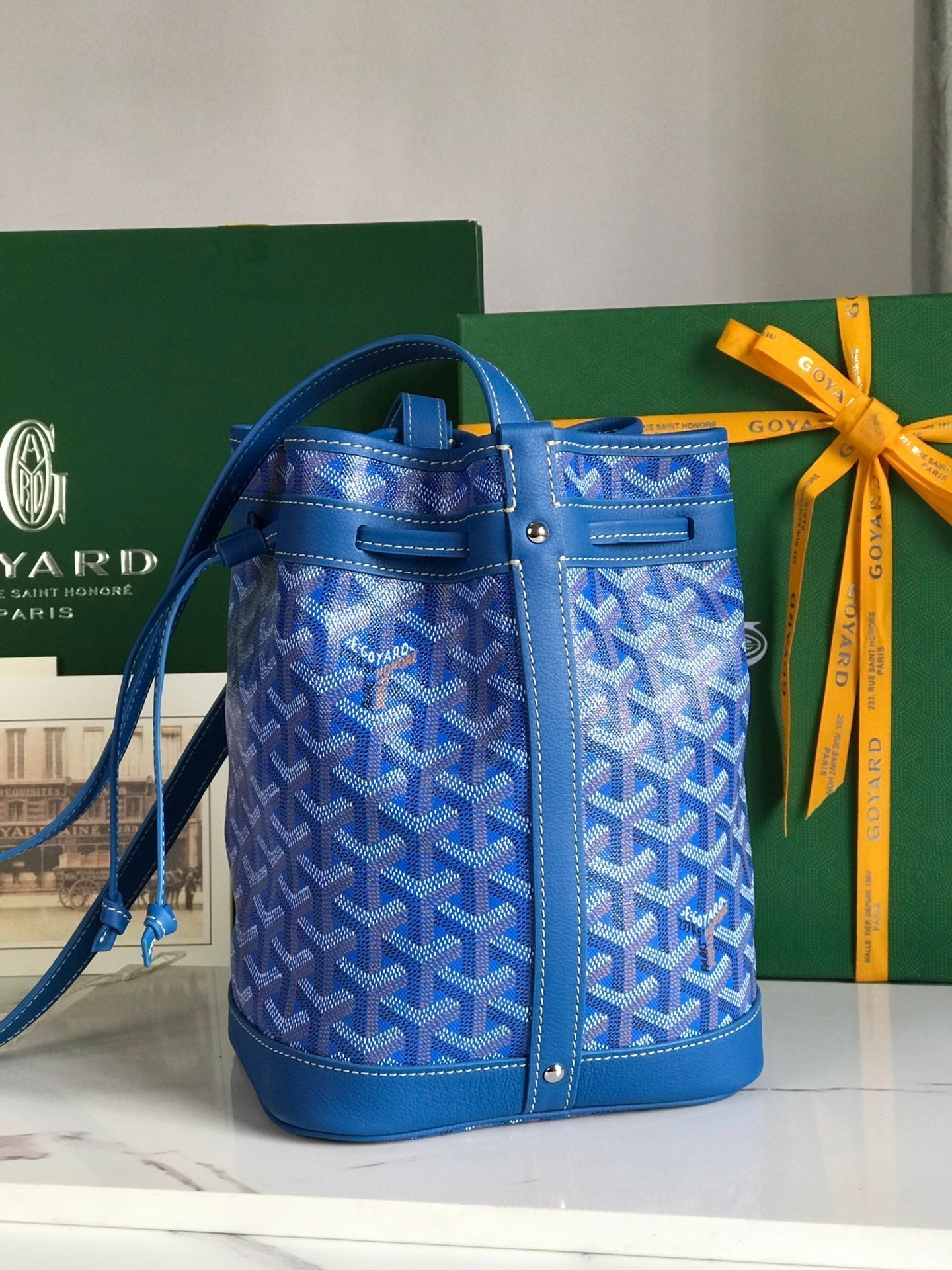 PETIT FLOT BUCKET BAG 22 IN SAPPHIRE BLUE GOYARDINE CANVAS AND LAMBSKIN TRIM