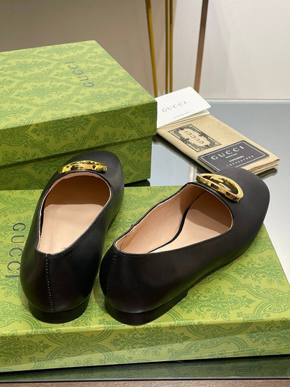 BLONDIE LOGO-PLAQUE LOAFERS IN BLACK CALFSKIN WITH GOLD HARDWARE