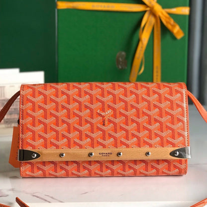 MONTE-CARLO PM CLUTCH 25 IN ORANGE GOYARDINE CANVAS