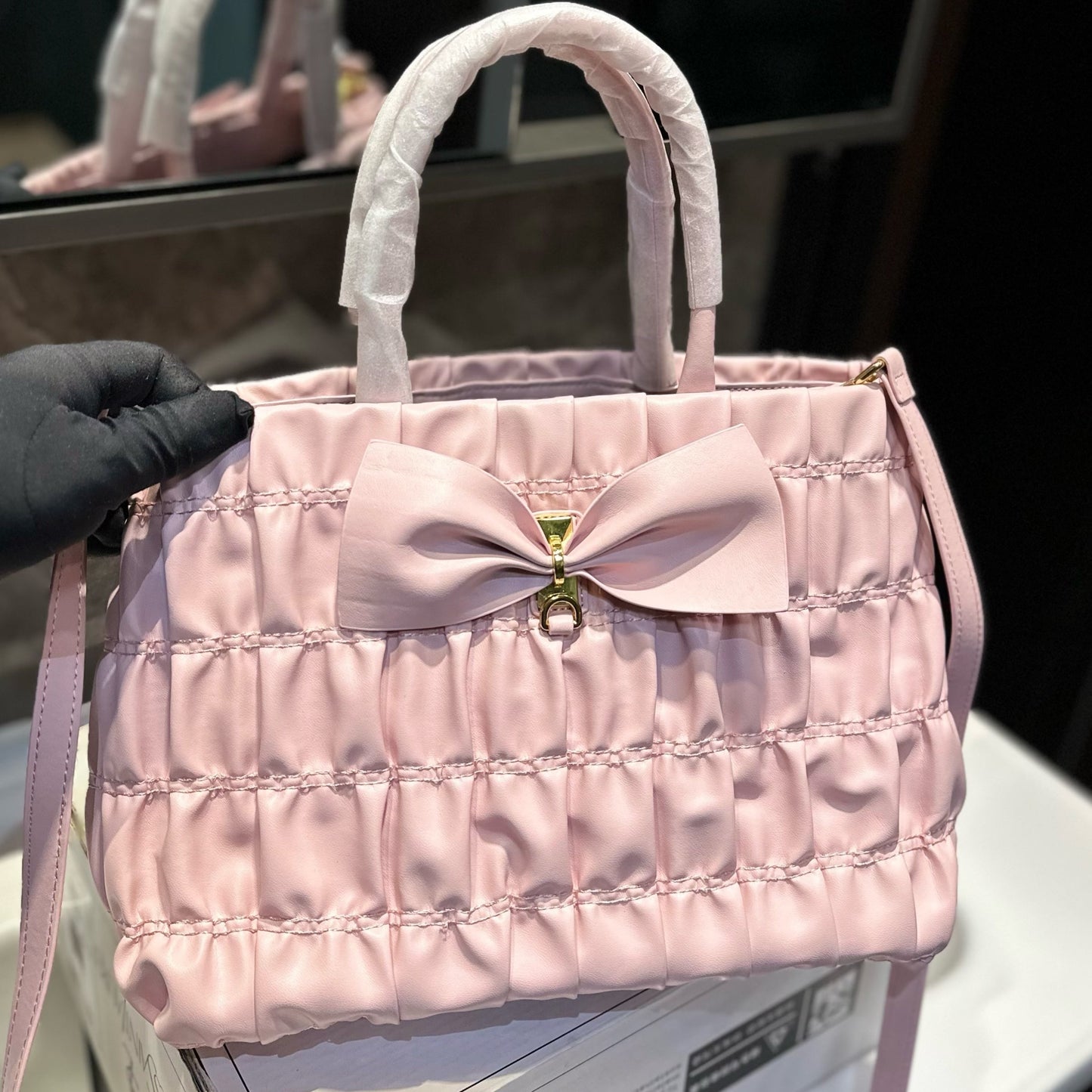 BOW DETAIL RUCHED TOP HANDLE BAG 29 IN LIGHT PINK SAFFIANO LEATHER