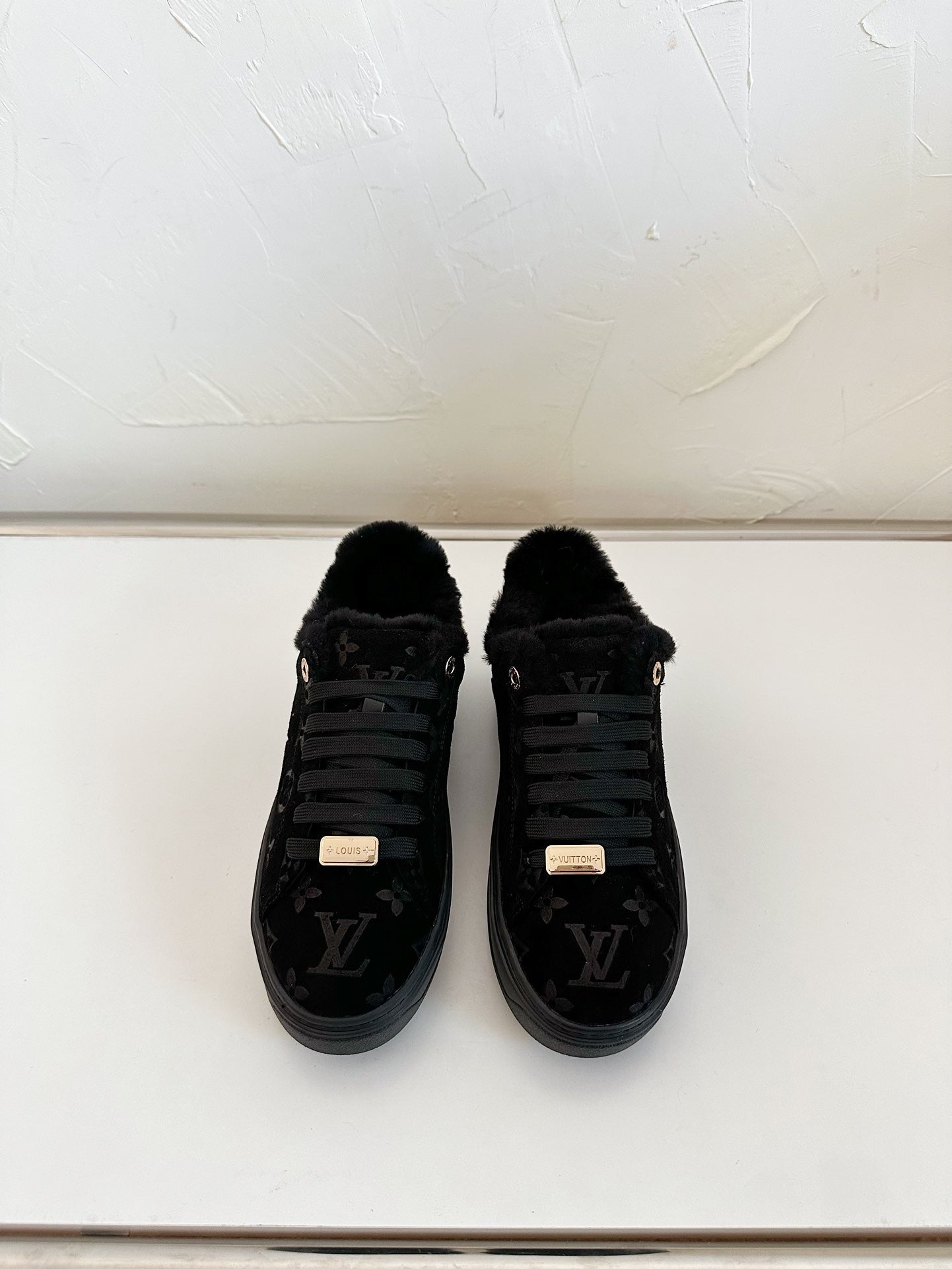 TIME OUT SNEAKER IN BLACK MONOGRAM EMBOSSED SUEDE WITH FLEECE LINING