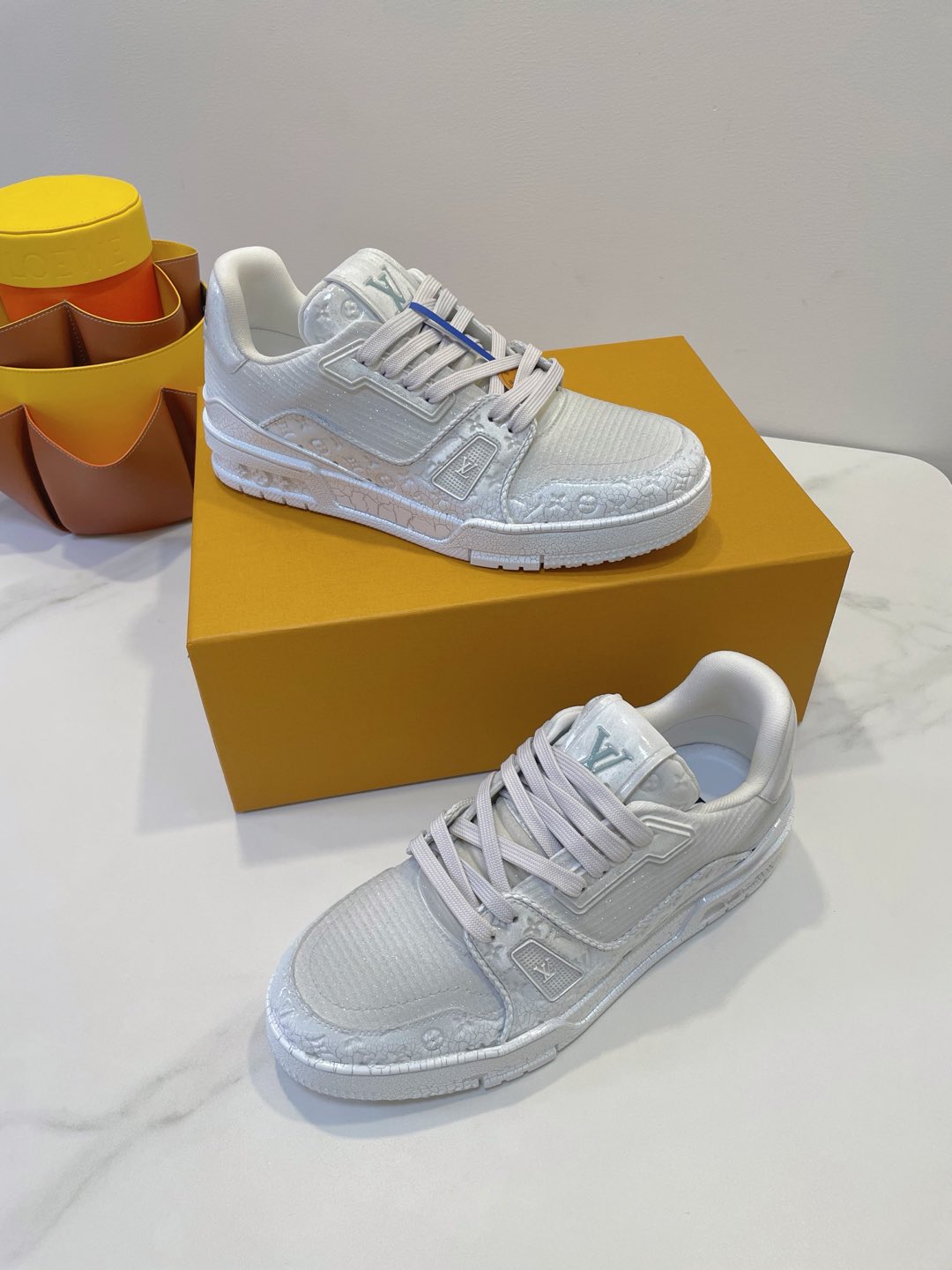 LV TRAINER MAXI SNEAKER IN WHITE EMBOSSED CALFSKIN