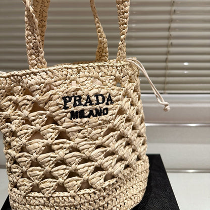 CROCHET BUCKET BAG 18 IN BEIGE WOVEN RAFFIA EMBROIDED LOGO