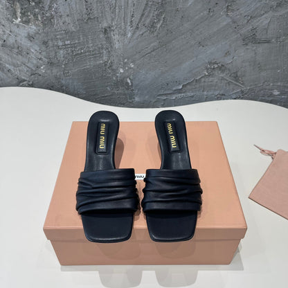 HIGH - HEEL BLACK SHEEPSKIN WITH STYLIZED STRAPS