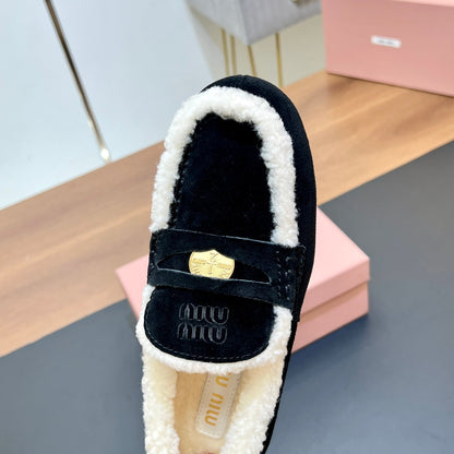 LOAFERS IN BLACK SUEDE AND WHITE SHEARLING TRIM