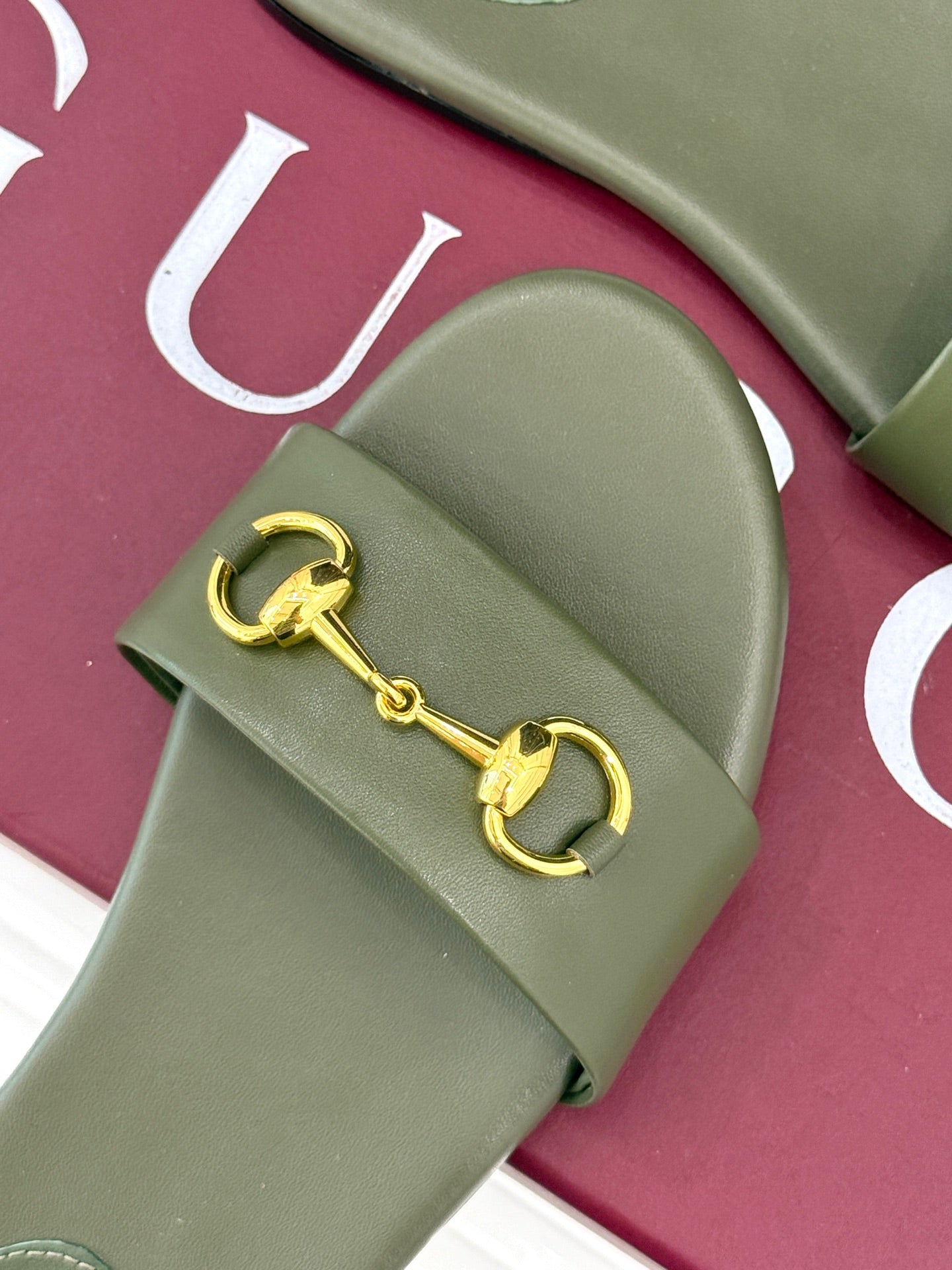SLIDE SANDALS IN MOSS GREEN CALFSKIN WITH GOLD HARDWARE