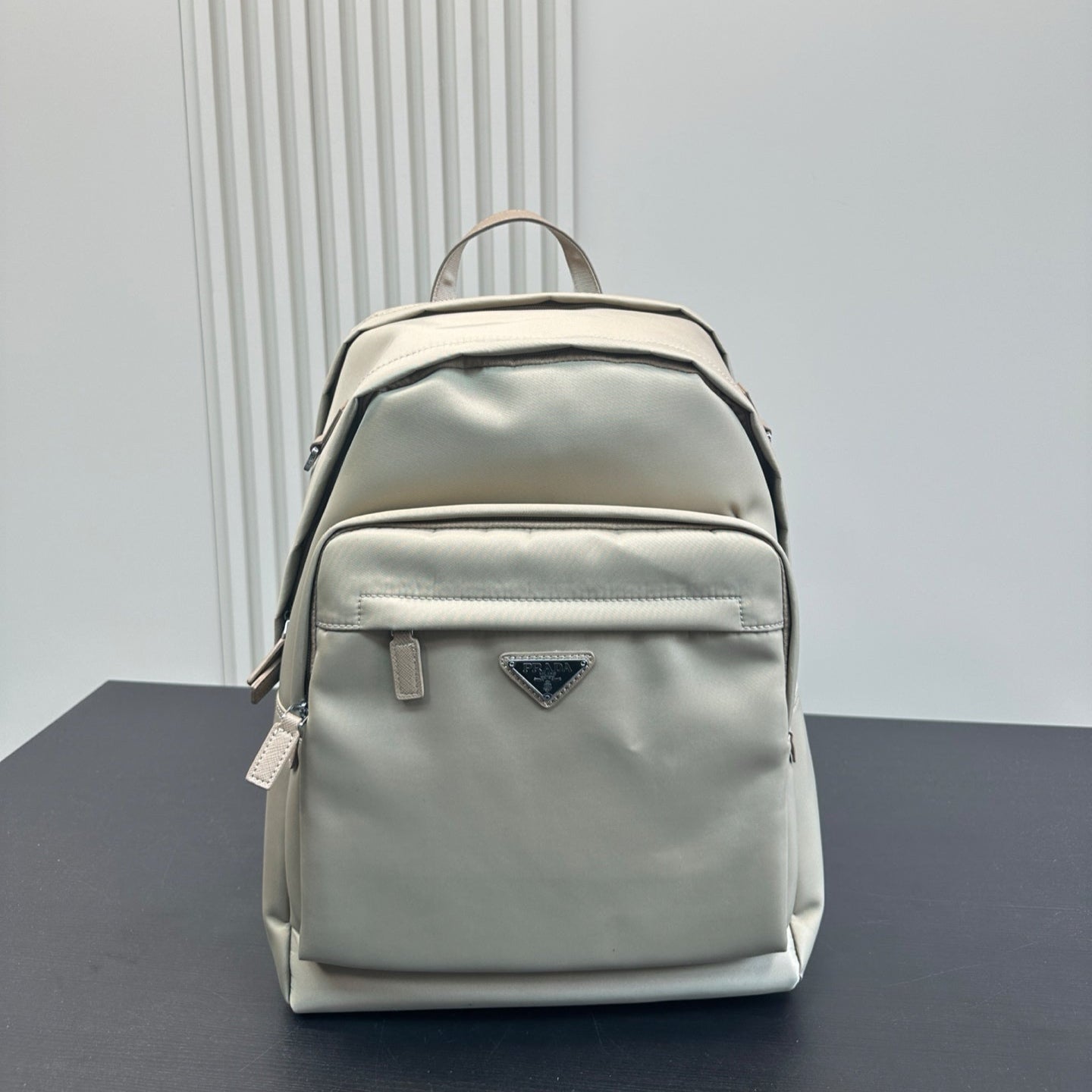 FRONT ZIP POCKET BACKPACK 40 IN BEIGE RE-NYLON