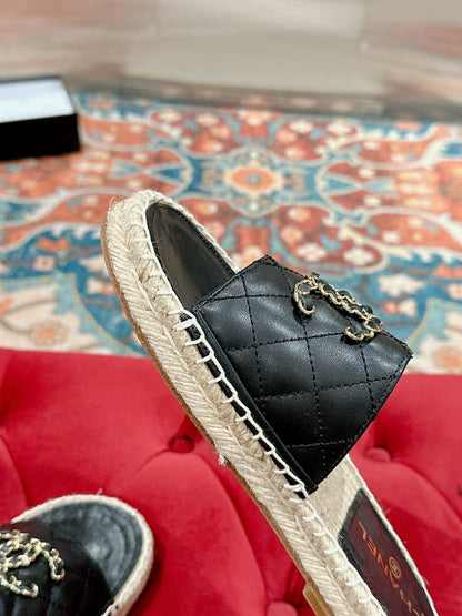 FLAT SLIPPERS IN BLACK LAMBSKIN AND WOVEN WITH LOGO