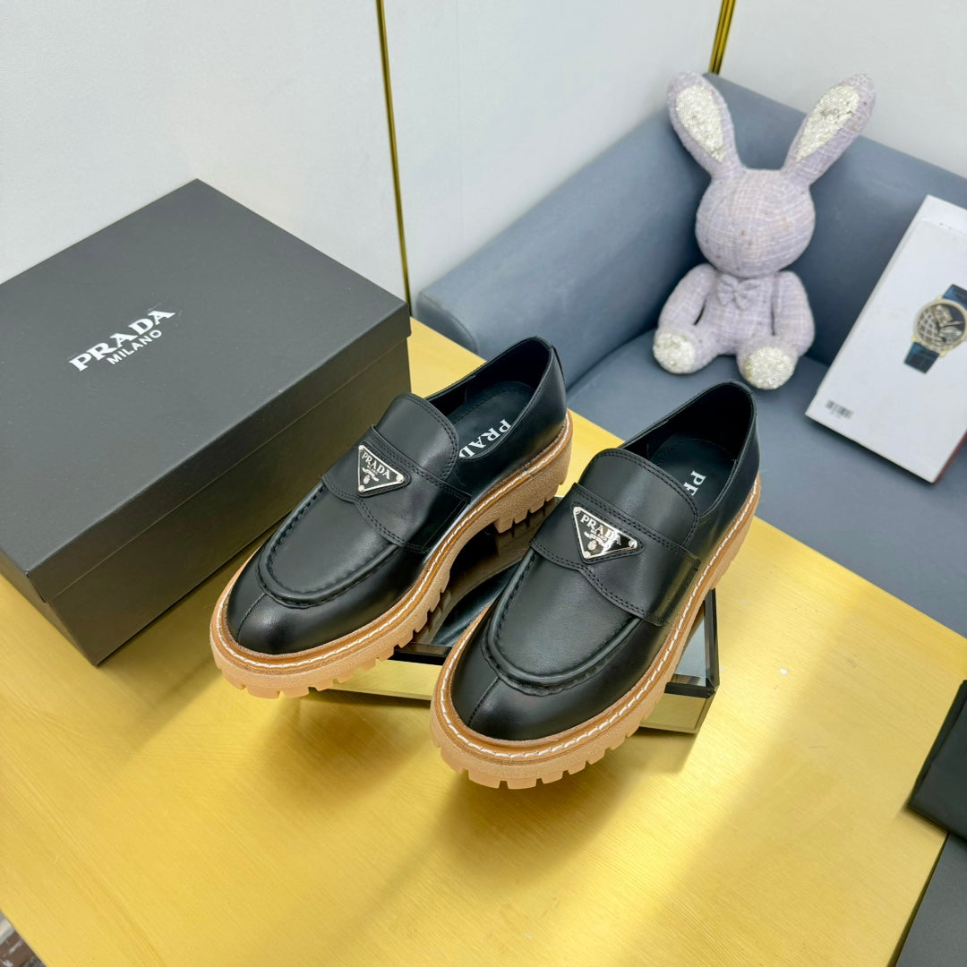 LOAFER WITH TRIANGLE LOGO IN BLACK CALFSKIN