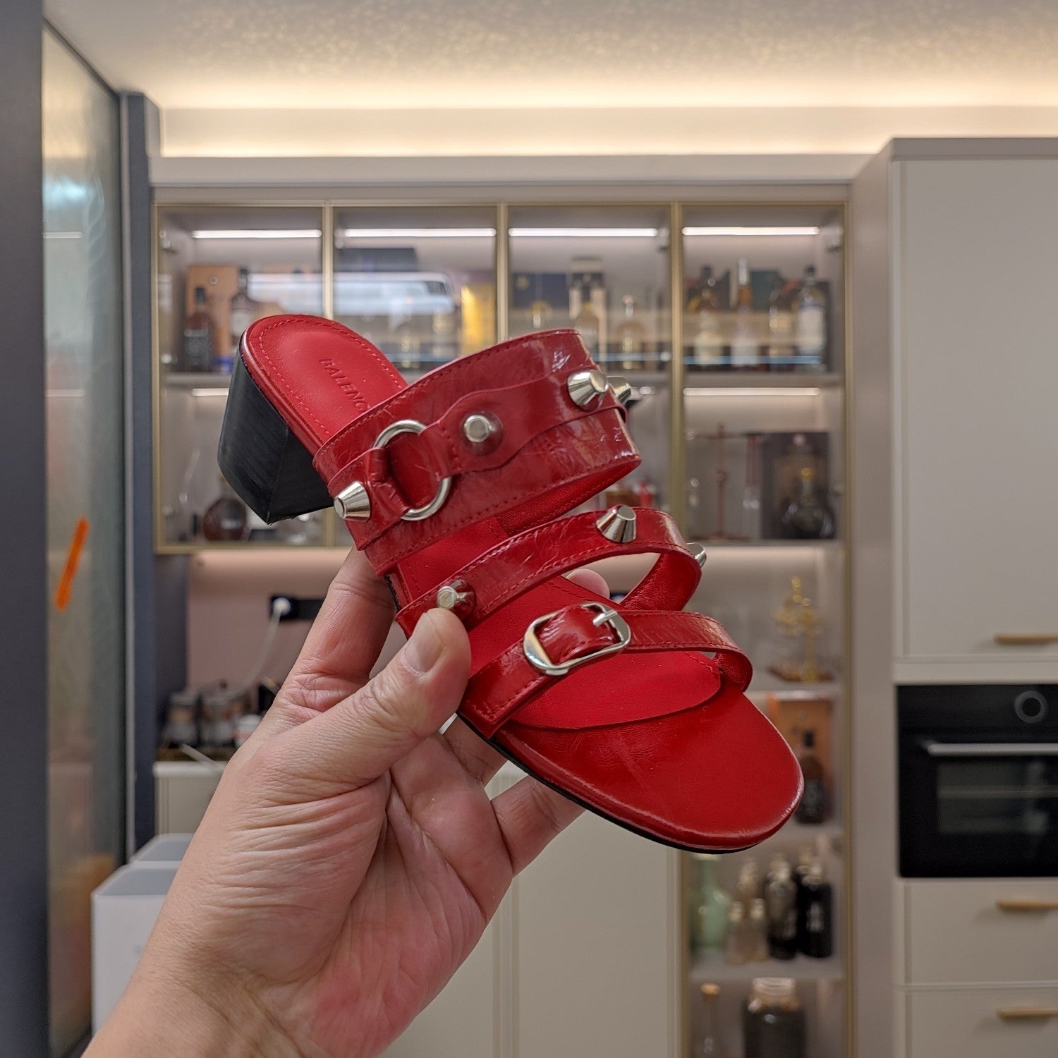 STRAPPY MEDIUM HEELED SANDALS IN RED STUDDED WAX-OIL SHEEPSKIN