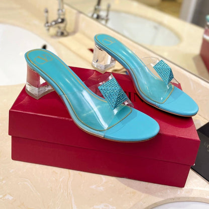 HIGH MULE 60MM IN AQUA BLUE SHEEPSKIN AND TRANSPARENT PVC